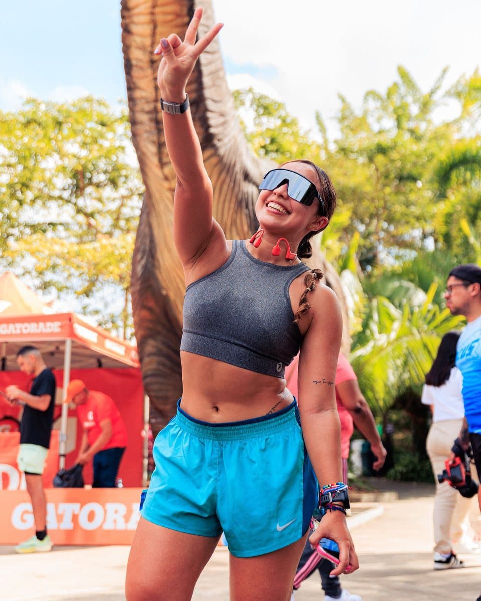 Creator celebrating at a race event beside a Gatorade tent